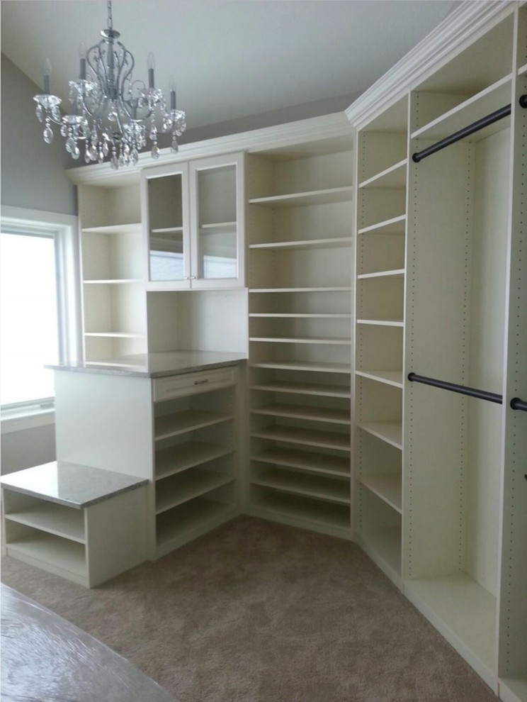Mid-sized transitional walk-in closet photo in Los Angeles with open cabinets and white cabinets