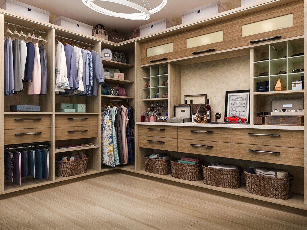 Example of a transitional walk-in closet design in Los Angeles