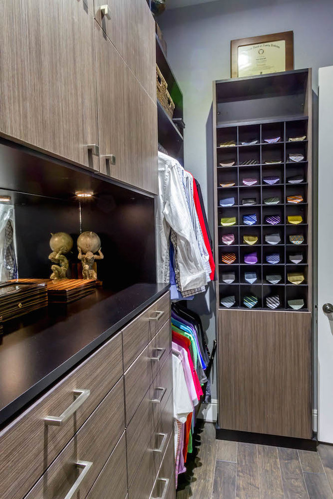 Inspiration for a mid-sized transitional men's medium tone wood floor walk-in closet remodel in Los Angeles with flat-panel cabinets and medium tone wood cabinets