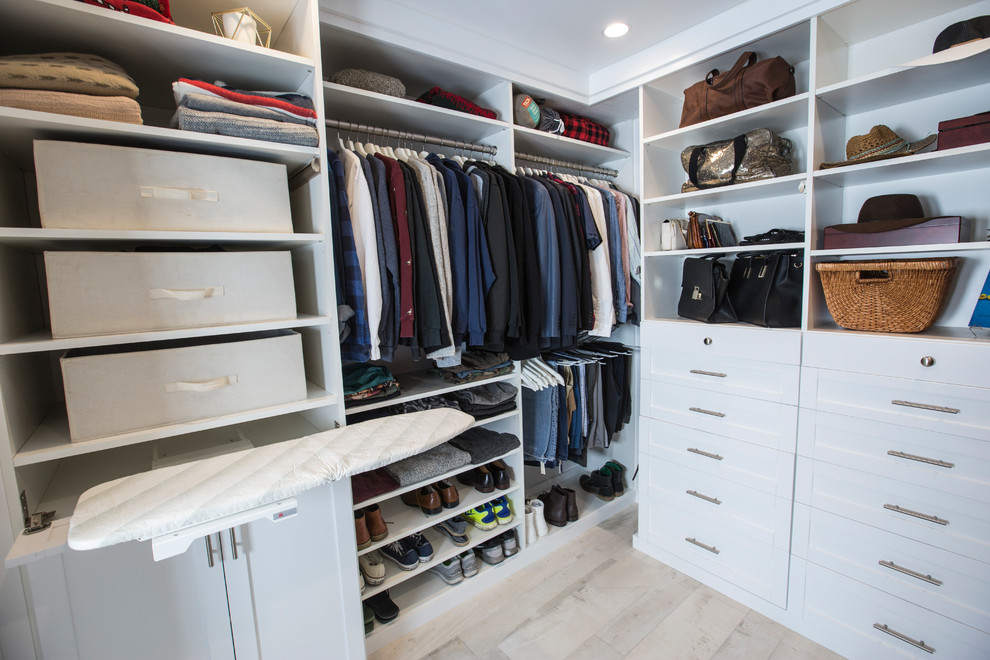 Inspiration for a medium sized traditional walk-in wardrobe in Los Angeles with shaker cabinets, white cabinets and terracotta flooring.