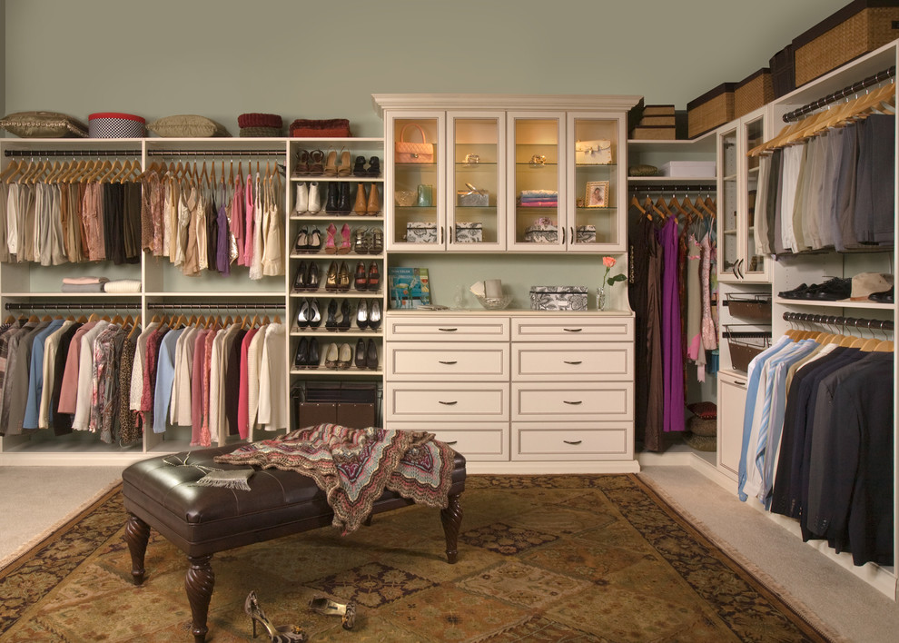 Inspiration for a large traditional gender neutral walk-in wardrobe in Salt Lake City with recessed-panel cabinets, white cabinets, carpet and beige floors.