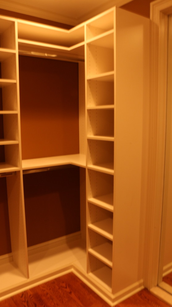 Example of a mid-sized classic walk-in closet design in New York