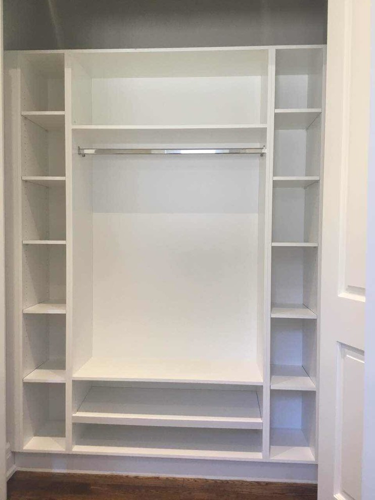 Small walk-in wardrobe for women in Toronto with flat-panel cabinets.