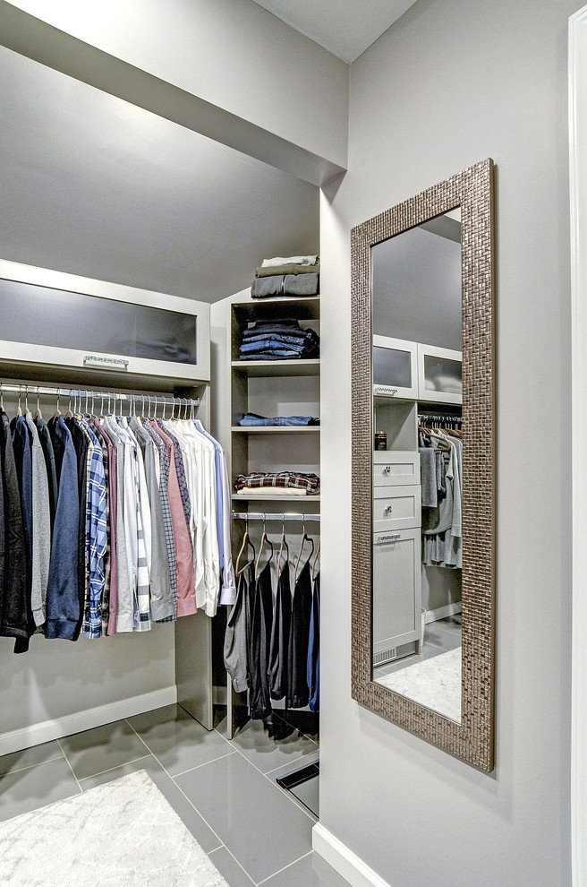 This is an example of a contemporary walk-in wardrobe in Philadelphia with shaker cabinets and grey cabinets.