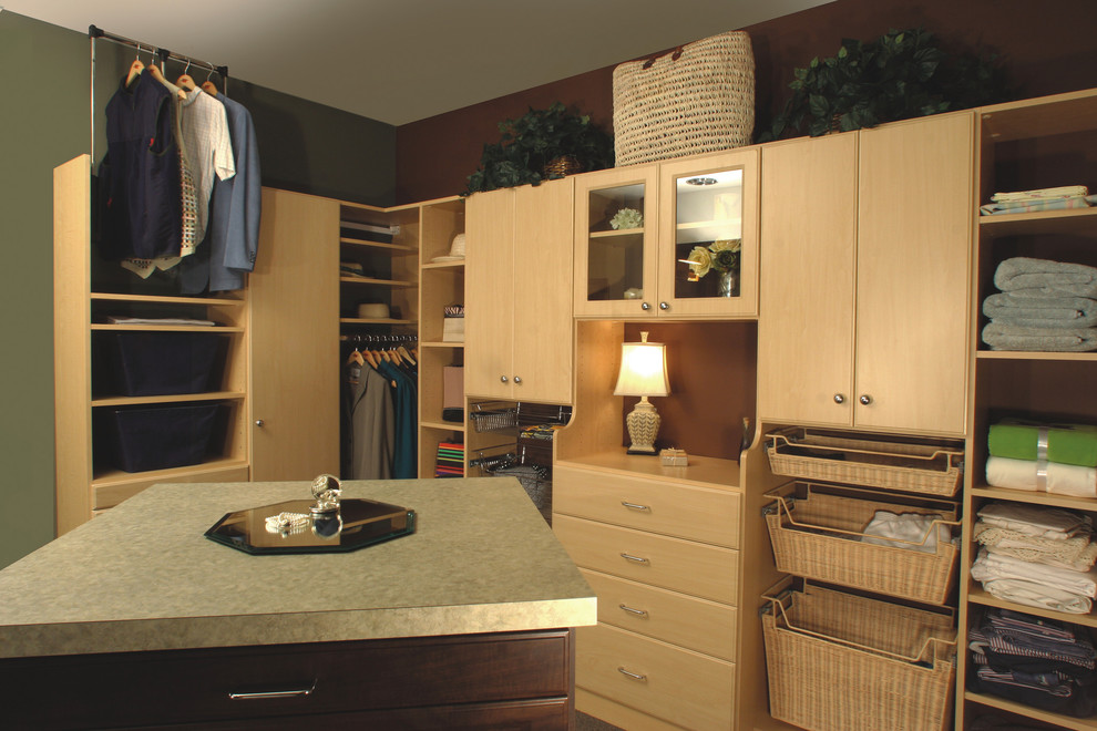 Inspiration for a contemporary gender-neutral walk-in closet remodel in Tampa with raised-panel cabinets and light wood cabinets