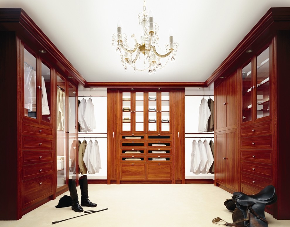 Photo of a large classic wardrobe in Toronto with shaker cabinets and medium wood cabinets.