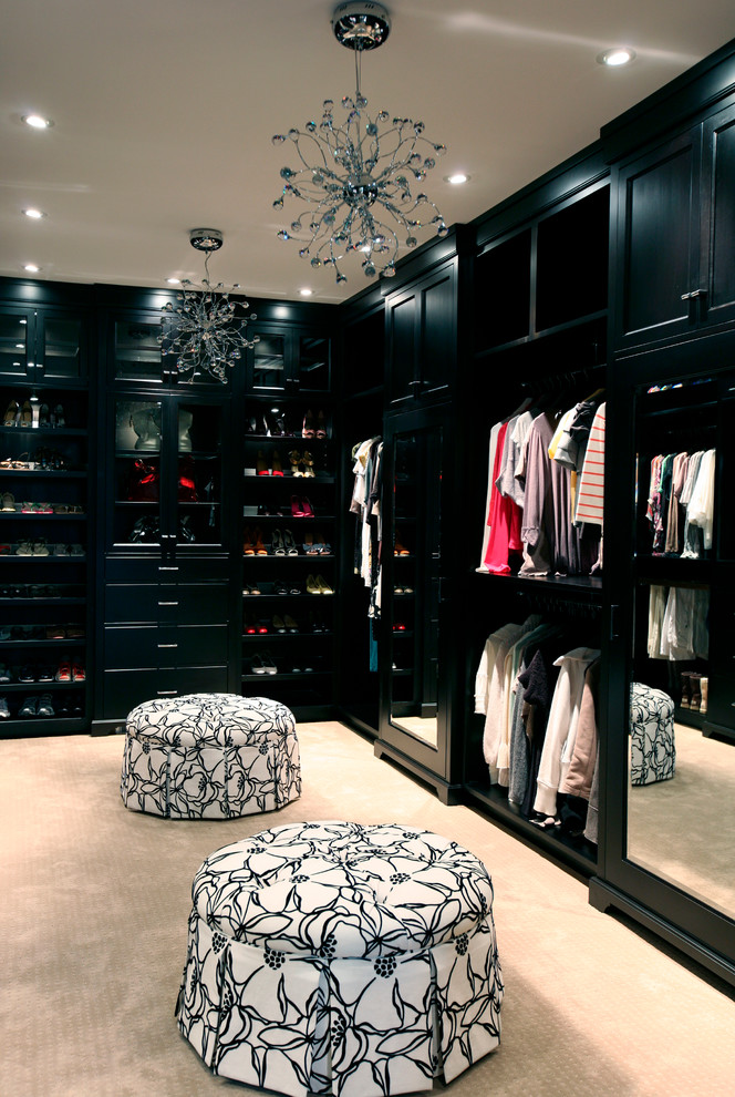 Trendy carpeted dressing room photo in Vancouver with black cabinets