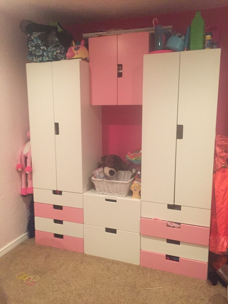 Example of a small minimalist women's carpeted reach-in closet design in Denver with flat-panel cabinets and white cabinets