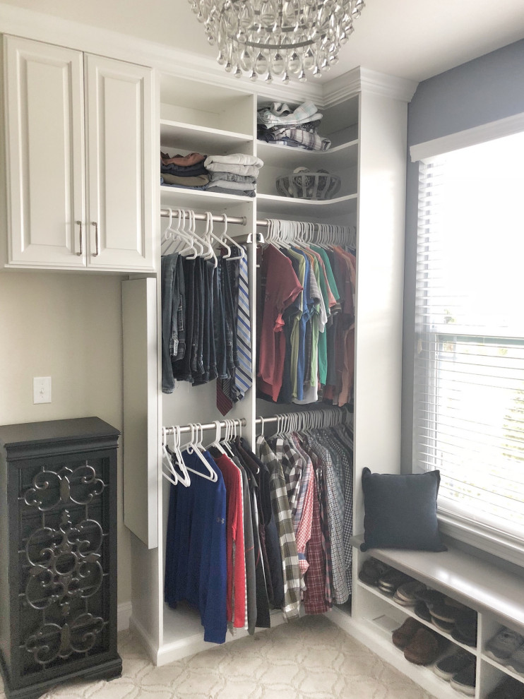 Inspiration for a large transitional carpeted and beige floor walk-in closet remodel in St Louis with raised-panel cabinets and white cabinets