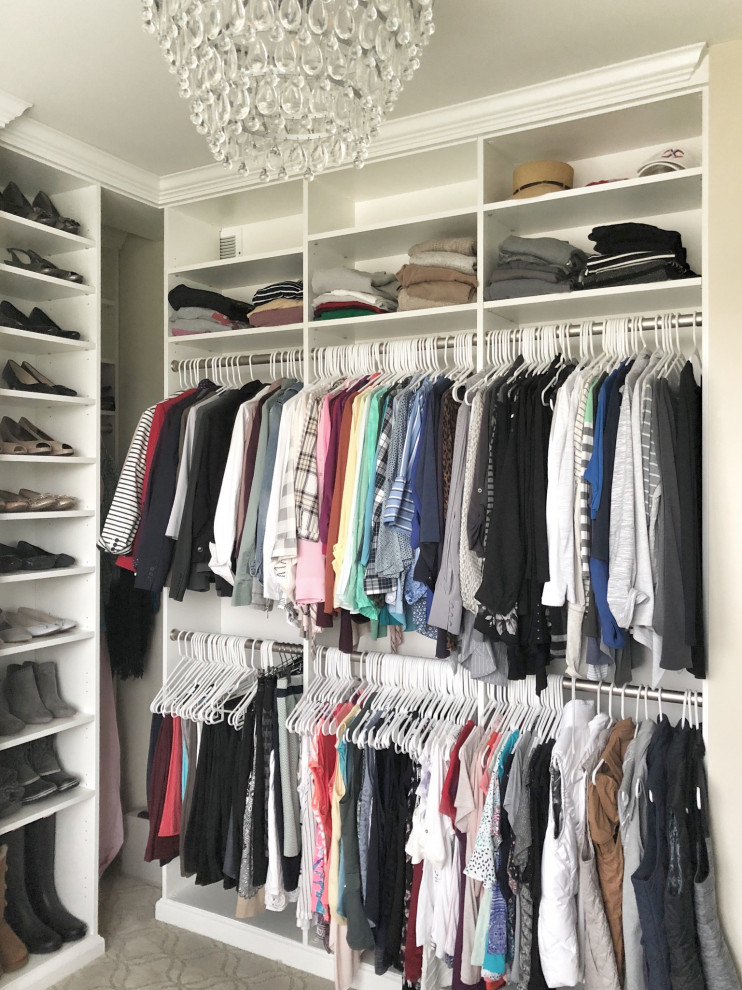 Design ideas for a large classic walk-in wardrobe in St Louis with raised-panel cabinets, white cabinets, carpet and beige floors.