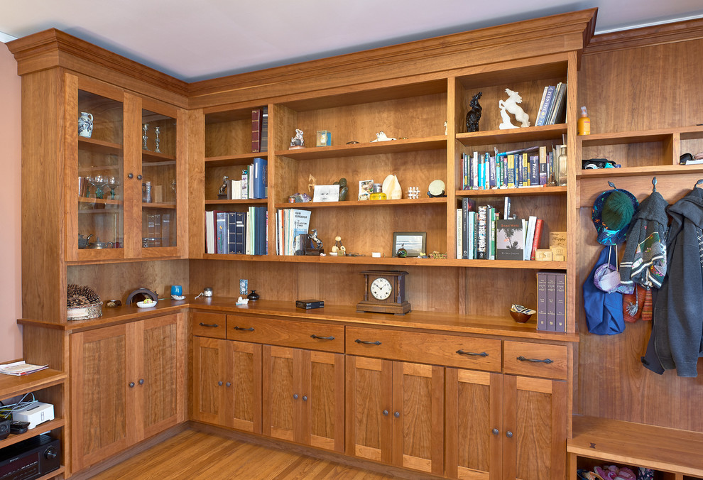Inspiration for a medium sized classic gender neutral walk-in wardrobe in San Francisco with shaker cabinets, medium wood cabinets, medium hardwood flooring and brown floors.