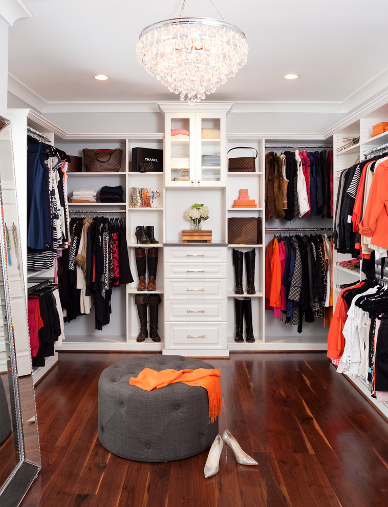 Dressing room - huge transitional gender-neutral medium tone wood floor dressing room idea in DC Metro with raised-panel cabinets and white cabinets