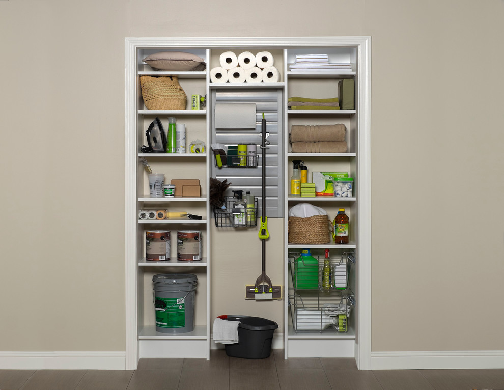 Small modern wardrobe in Toronto with white cabinets.