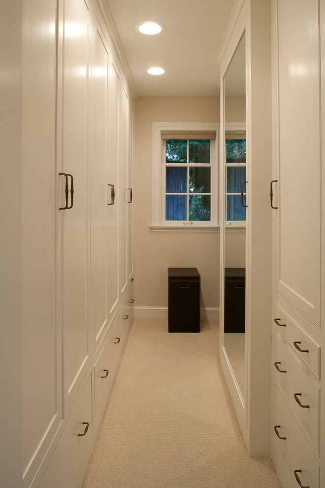 Walk-in closet - mid-sized traditional gender-neutral carpeted and beige floor walk-in closet idea in Seattle with shaker cabinets and white cabinets