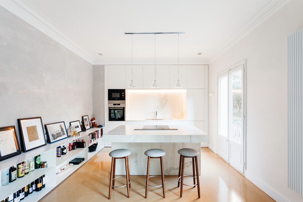 Photo of a medium sized contemporary single-wall open plan kitchen in Other with flat-panel cabinets, white cabinets, marble worktops, white splashback, marble splashback, stainless steel appliances, an island and white worktops.