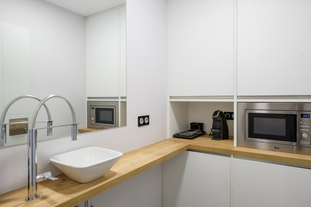 This is an example of a small modern kitchen in Other.