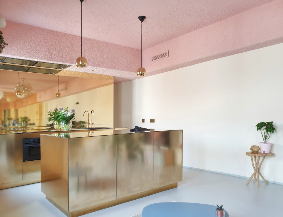 Inspiration för små kök med öppen planlösning, med en rustik diskho, bänkskiva i akrylsten, betonggolv och en köksö