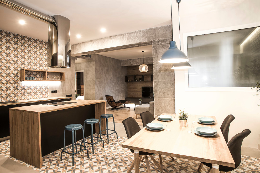 Inspiration for a mid-sized industrial single-wall multicolored floor and concrete floor eat-in kitchen remodel in Barcelona with black cabinets, wood countertops, an island, flat-panel cabinets, multicolored backsplash, ceramic backsplash and stainless steel appliances