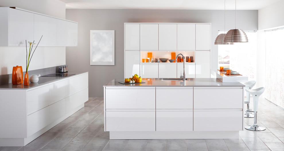 Inspiration for a large modern u-shaped porcelain tile and gray floor open concept kitchen remodel in Malaga with an undermount sink, flat-panel cabinets, white cabinets, quartz countertops, gray backsplash, window backsplash, paneled appliances, an island and gray countertops