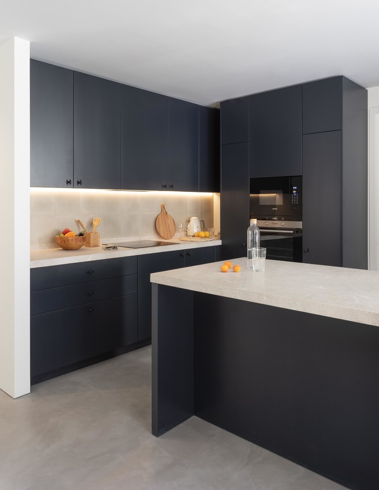 This is an example of a contemporary l-shaped kitchen in Other with flat-panel cabinets, black cabinets, an island, grey floors and white worktops.