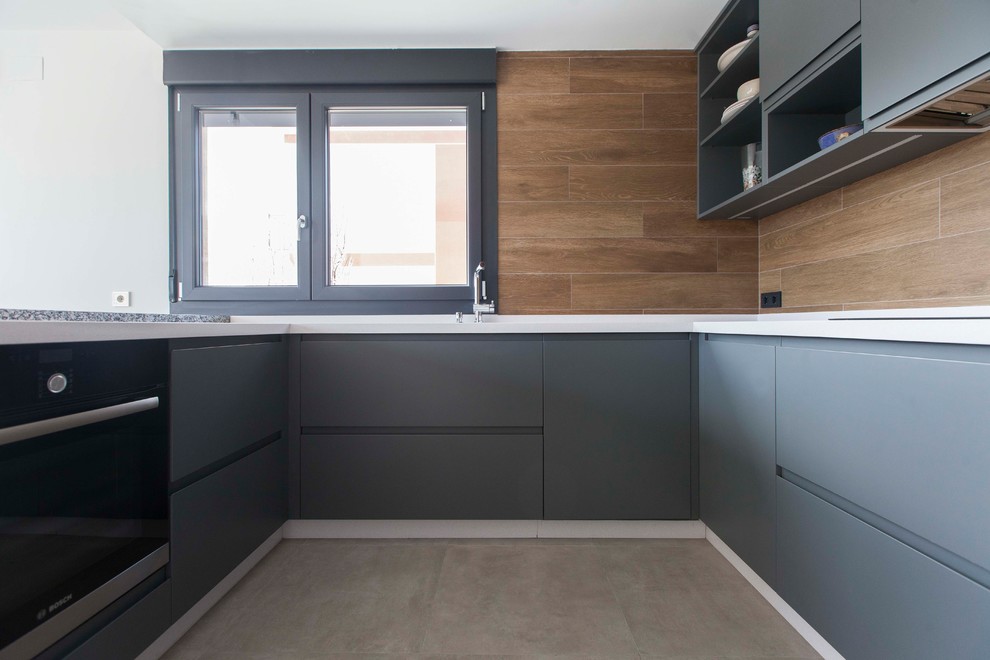 Example of a mid-sized minimalist u-shaped ceramic tile and beige floor open concept kitchen design in Other with flat-panel cabinets, gray cabinets, an undermount sink, quartz countertops, brown backsplash, ceramic backsplash, stainless steel appliances and an island