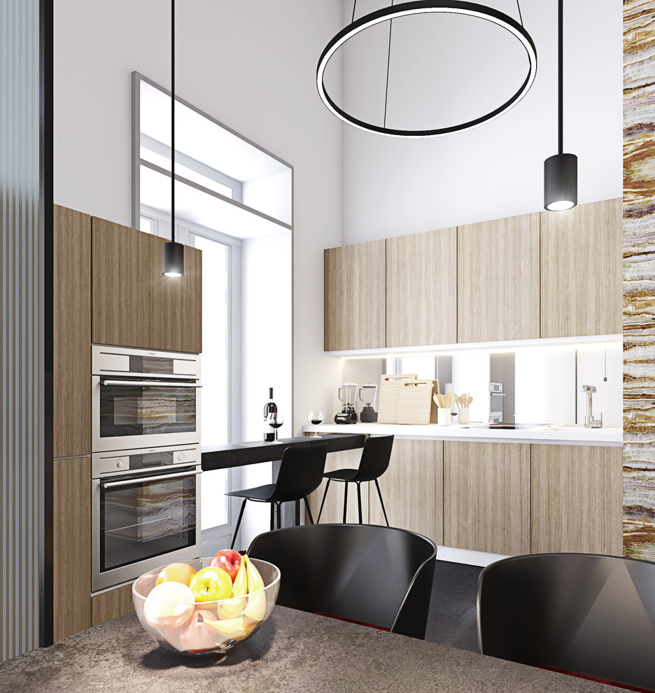 Moderne Küche mit flächenbündigen Schrankfronten, beigen Schränken, Küchengeräten aus Edelstahl, Kücheninsel, grauem Boden und weißer Arbeitsplatte in Sonstige