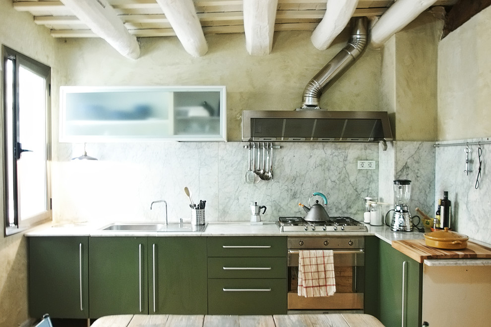 Eat-in kitchen - mid-sized contemporary l-shaped eat-in kitchen idea in Barcelona with a drop-in sink, flat-panel cabinets, green cabinets, marble countertops, gray backsplash, stone slab backsplash, stainless steel appliances and no island