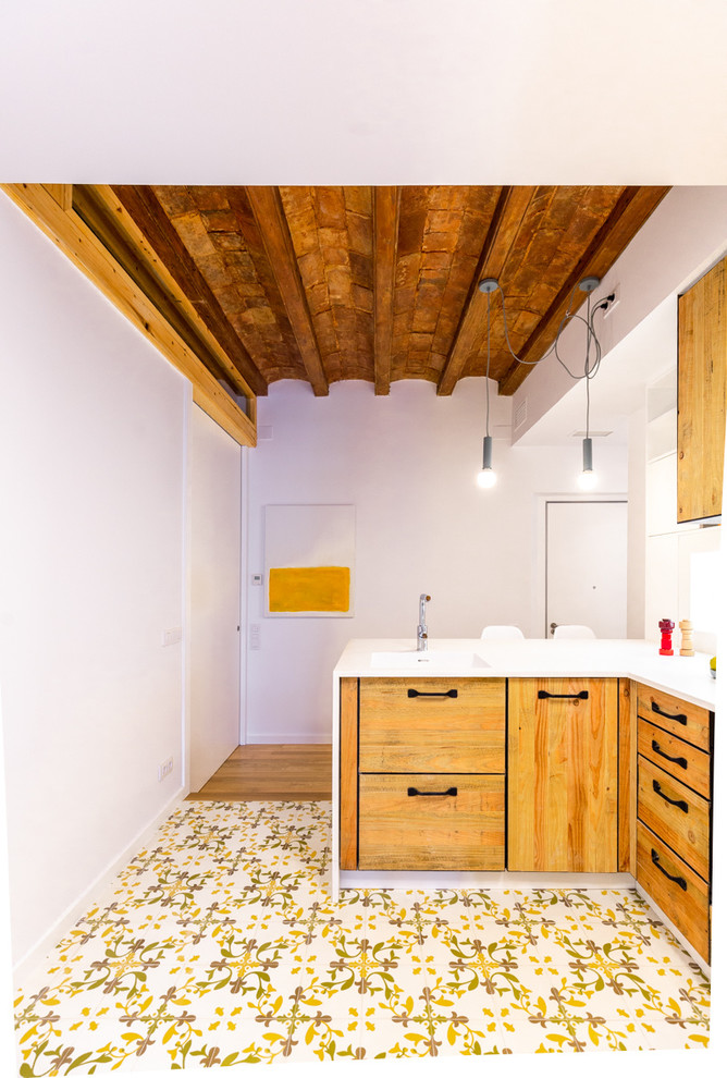 This is an example of a medium sized mediterranean u-shaped kitchen in Barcelona.