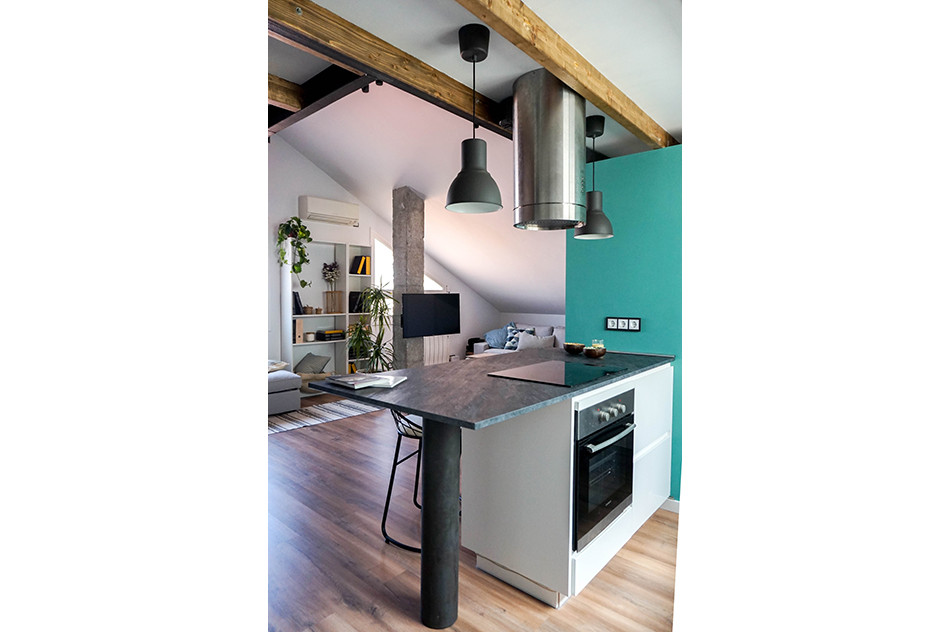 Inspiration for a medium sized industrial single-wall open plan kitchen in Barcelona with white cabinets, integrated appliances, laminate floors, an island, brown floors and grey worktops.