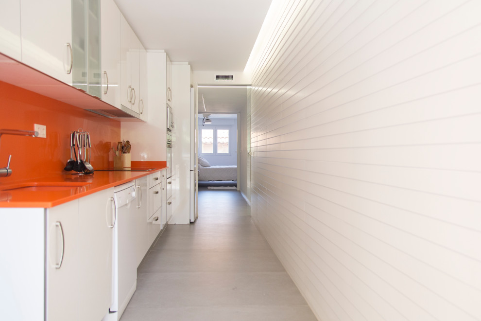 This is an example of a medium sized modern single-wall open plan kitchen in Other with a single-bowl sink, flat-panel cabinets, white cabinets, engineered stone countertops, orange splashback, no island and orange worktops.