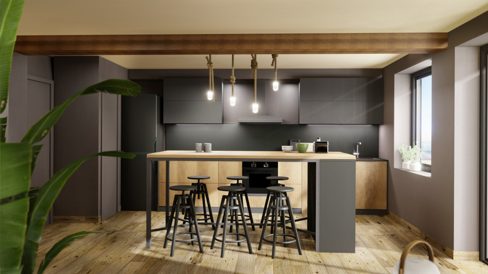 Immagine di una cucina industriale di medie dimensioni con ante lisce, top in granito, paraspruzzi nero, pavimento in laminato, pavimento marrone e top nero