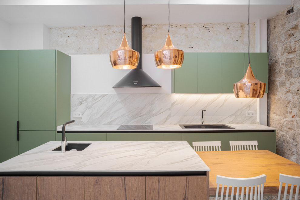 Inspiration for a contemporary galley kitchen remodel in Other with a drop-in sink, flat-panel cabinets, green cabinets, paneled appliances, an island and white countertops