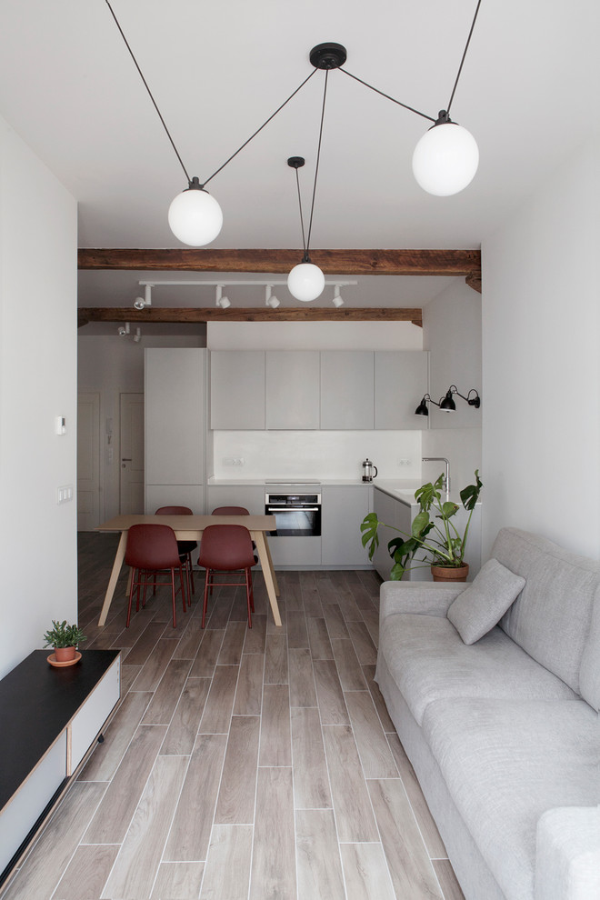 Свежая идея для дизайна: кухня в скандинавском стиле с бежевым полом - отличное фото интерьера