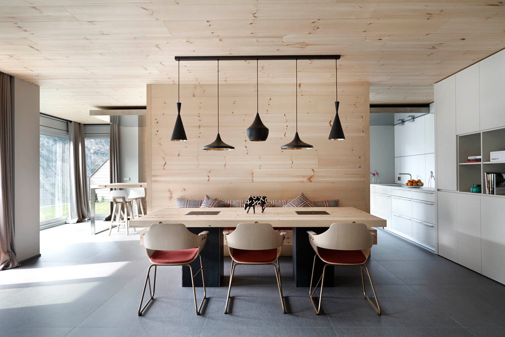Idée de décoration pour une salle à manger nordique de taille moyenne avec un mur blanc, un sol en carrelage de céramique et aucune cheminée.