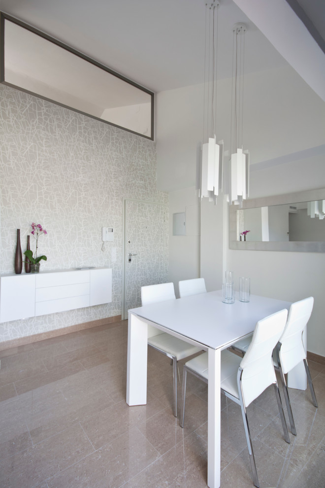 Photo of a medium sized contemporary enclosed dining room in Valencia with white walls, light hardwood flooring and no fireplace.