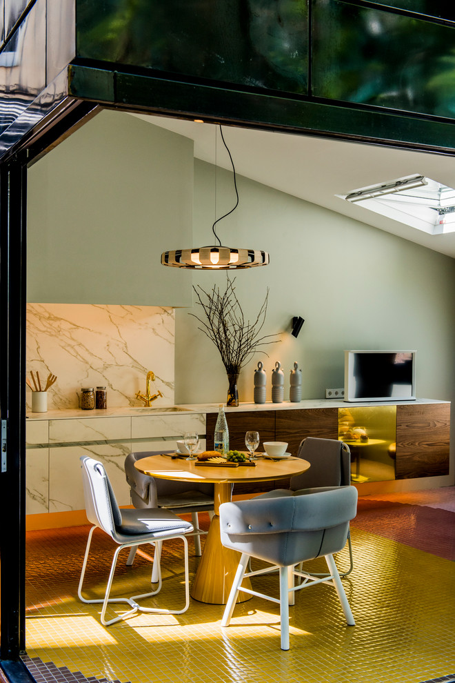 This is an example of a small scandinavian open plan dining room in Madrid with green walls and no fireplace.