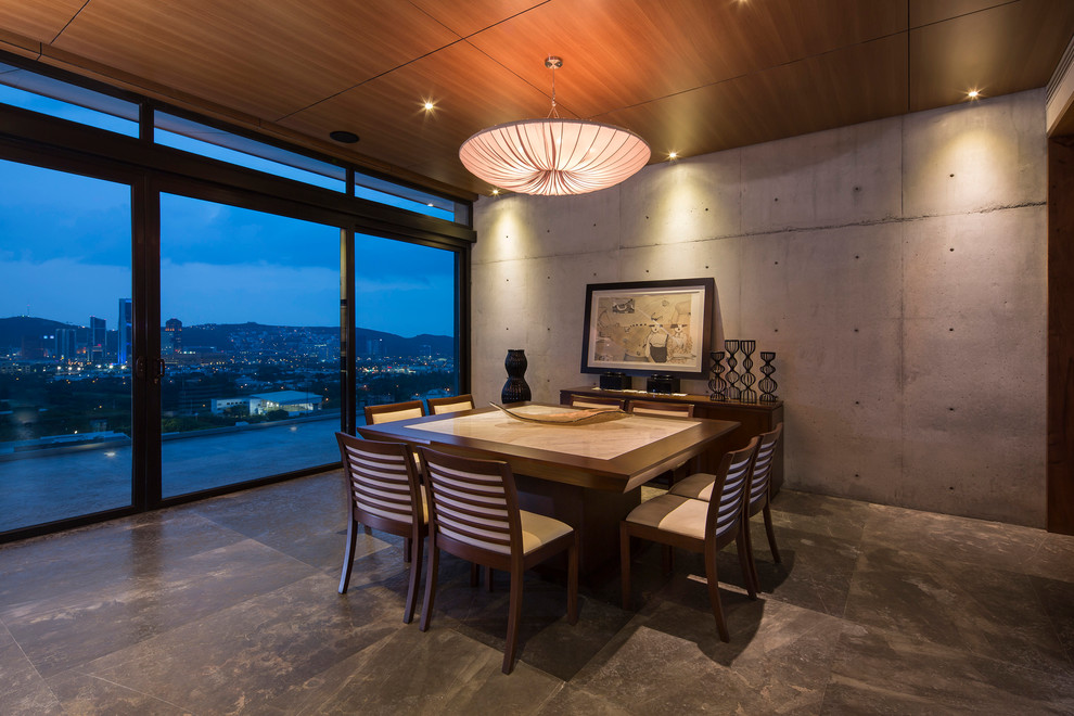 Example of a trendy dining room design in Other with gray walls