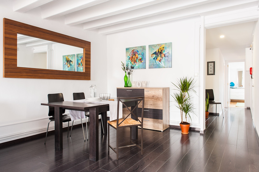 Example of a mid-sized danish dark wood floor great room design in Barcelona with white walls and no fireplace