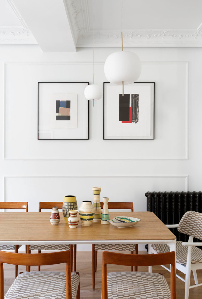 Inspiration for a scandi dining room in Other with white walls, light hardwood flooring and no fireplace.