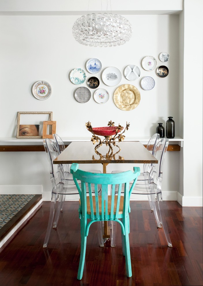 Photo of a small eclectic open plan dining room in Other with white walls, medium hardwood flooring and no fireplace.