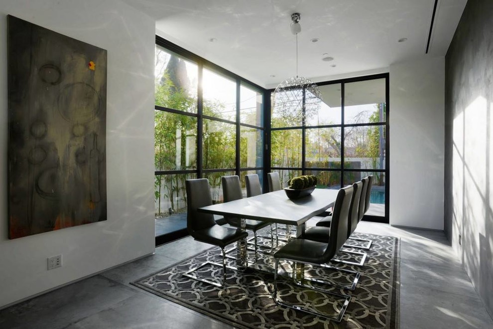 Medium sized contemporary enclosed dining room in Other with white walls and no fireplace.