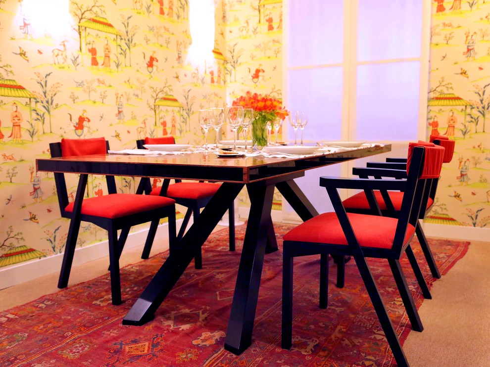 Medium sized world-inspired enclosed dining room in Barcelona with multi-coloured walls, carpet and no fireplace.
