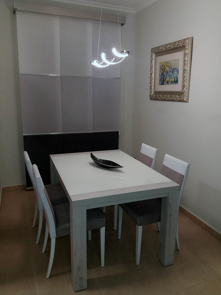 This is an example of a small modern enclosed dining room in Other.