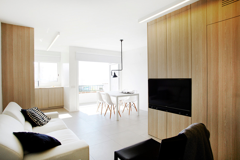 Foto di una piccola sala da pranzo aperta verso il soggiorno scandinava con pareti bianche e pavimento con piastrelle in ceramica