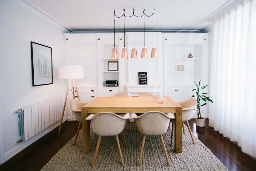 Medium sized scandinavian open plan dining room in Valencia with white walls, dark hardwood flooring and no fireplace.