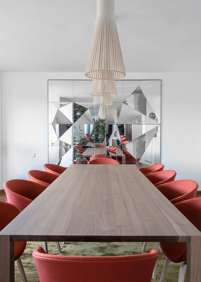 Great room - large contemporary dark wood floor and brown floor great room idea in Other with white walls and no fireplace