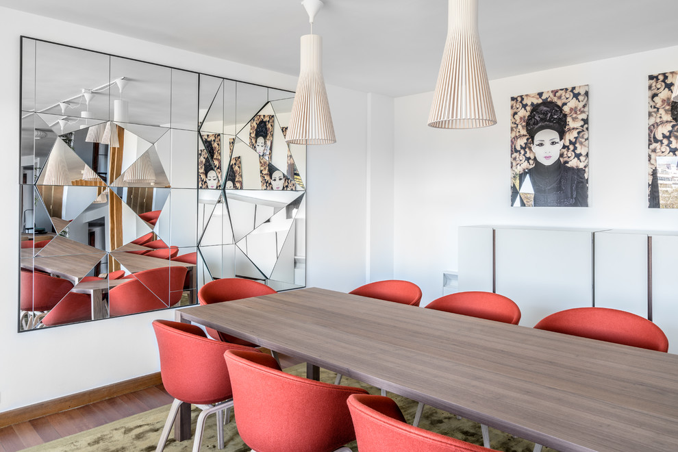 Example of a large trendy dark wood floor and brown floor great room design in Other with white walls and no fireplace