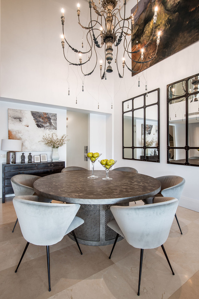 This is an example of a medium sized contemporary open plan dining room in Madrid with white walls, porcelain flooring, beige floors and feature lighting.