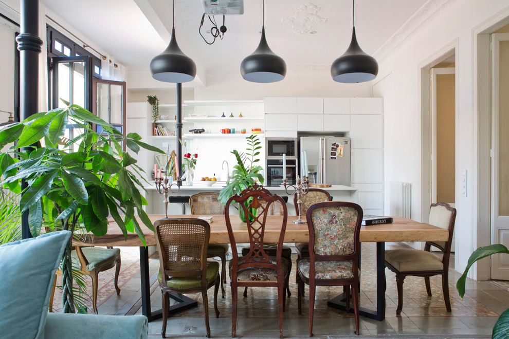 Eclectic kitchen/dining room in Barcelona with white walls.