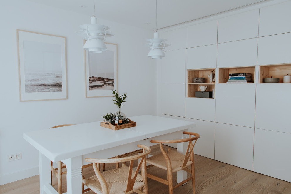 Inspiration for a medium sized scandinavian kitchen/dining room in Other with white walls, light hardwood flooring, no fireplace and brown floors.